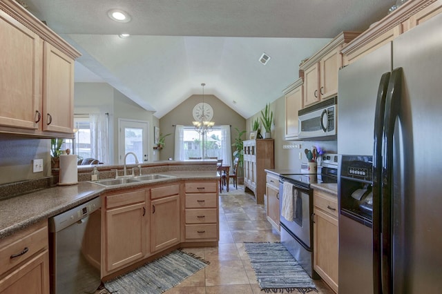105 Deer Run, Willard, MO 65781 - kitchen with stainless steel appliances, light brown cabinetry, a peninsula, a chandelier, and vaulted ceiling