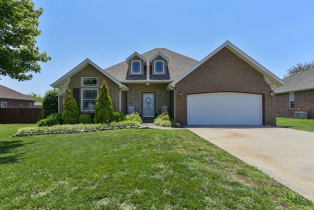 105 Deer Run, Willard, MO 65781 - view of front of home featuring an attached garage, driveway, stone siding, brick siding, and roof with shingles