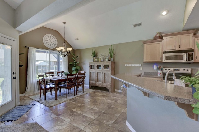 105 Deer Run, Willard, MO 65781 - kitchen featuring stainless steel microwave, plenty of natural light, range, lofted ceiling, and light brown cabinets