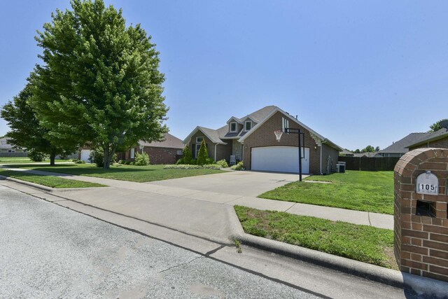 105 Deer Run, Willard, MO 65781 - traditional home featuring concrete driveway, a garage, and brick siding