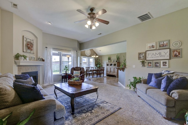 105 Deer Run, Willard, MO 65781 - living room with a fireplace, ceiling fan, vaulted ceiling, a chandelier, and carpet flooring