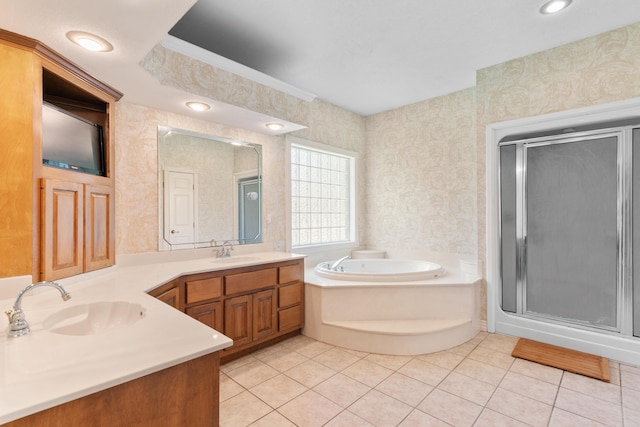 3702 E Dartmoor Ct, Springfield, MO 65802 - bathroom with double vanity, a stall shower, a garden tub, tile patterned floors, and wallpapered walls