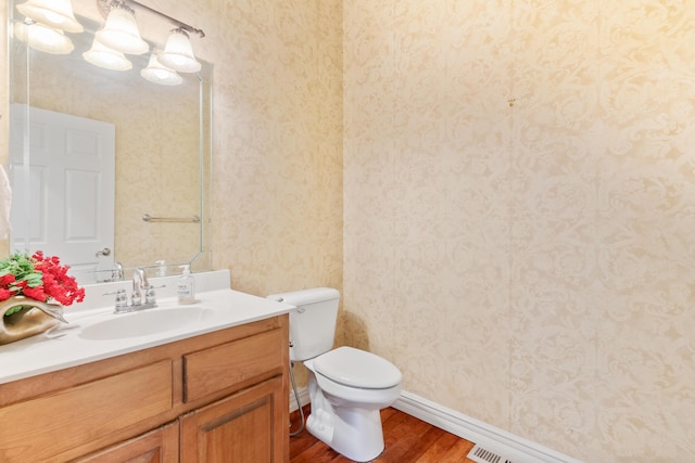 3702 E Dartmoor Ct, Springfield, MO 65802 - bathroom featuring wood finished floors, vanity, and wallpapered walls