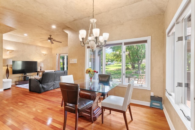 3702 E Dartmoor Ct, Springfield, MO 65802 - dining room with light wood-style flooring, plenty of natural light, a chandelier, and a high ceiling