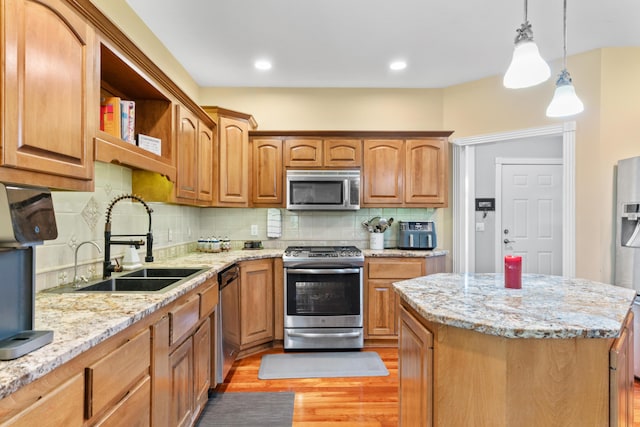 3702 E Dartmoor Ct, Springfield, MO 65802 - kitchen with appliances with stainless steel finishes, light wood-style flooring, decorative backsplash, and light stone countertops
