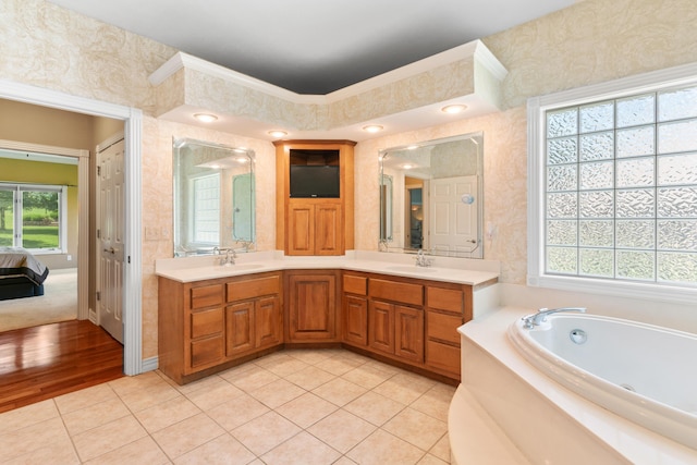 3702 E Dartmoor Ct, Springfield, MO 65802 - bathroom with plenty of natural light, double vanity, a jetted tub, and tile patterned flooring