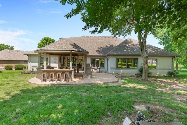 3702 E Dartmoor Ct, Springfield, MO 65802 - back of property with a patio, a yard, and roof with shingles