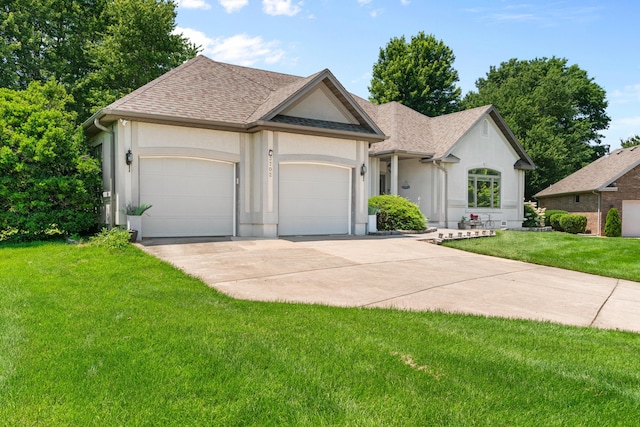 3702 E Dartmoor Ct, Springfield, MO 65802 - view of front of house with concrete driveway, an attached garage, stucco siding, a front yard, and roof with shingles