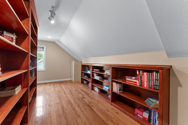 160 Brookside Ct, Branson, MO 65616 - bonus room with lofted ceiling, wood finished floors, and a textured ceiling
