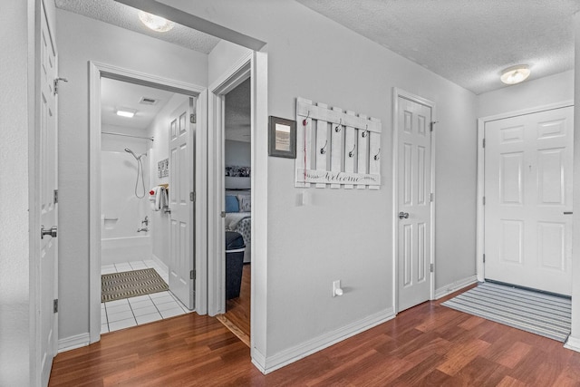 161 Avondale Dr Unit 1, Branson, MO 65616 - entrance foyer with a textured ceiling and wood finished floors