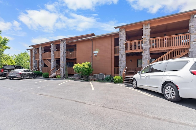 161 Avondale Dr Unit 1, Branson, MO 65616 - view of property featuring stairway and uncovered parking
