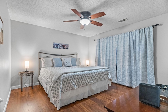 161 Avondale Dr Unit 1, Branson, MO 65616 - bedroom with wood finished floors, a textured ceiling, and ceiling fan