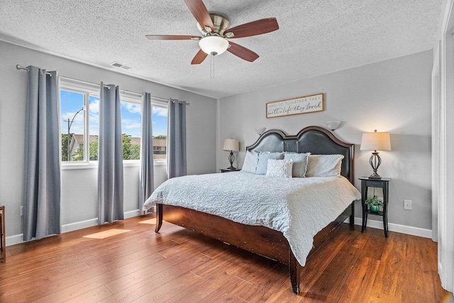 161 Avondale Dr Unit 1, Branson, MO 65616 - bedroom with a textured ceiling, wood finished floors, and a ceiling fan