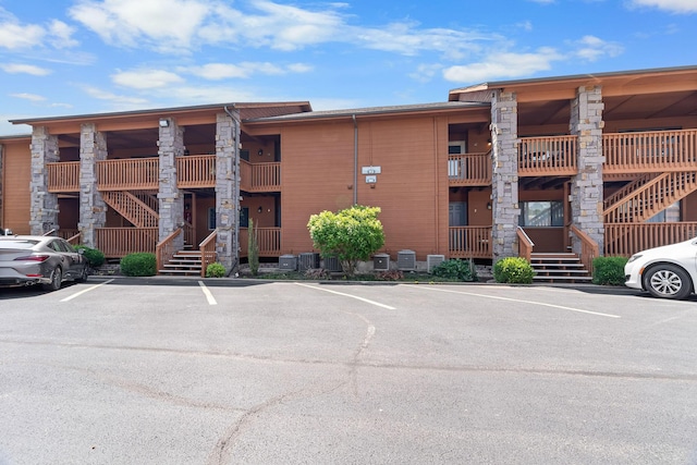 161 Avondale Dr Unit 1, Branson, MO 65616 - view of building exterior with uncovered parking and stairway