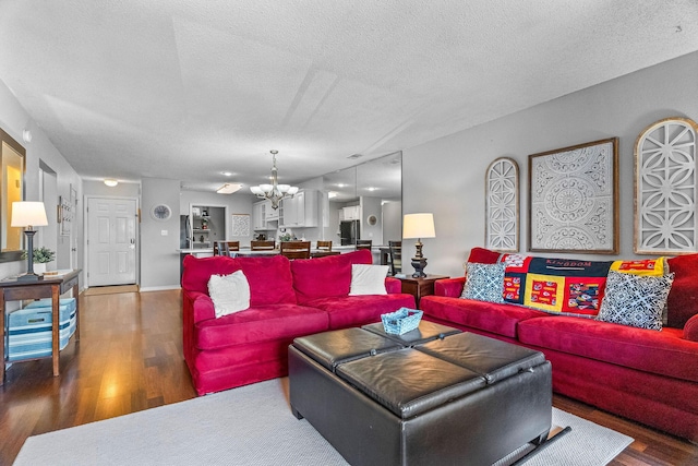 161 Avondale Dr Unit 1, Branson, MO 65616 - living area featuring a chandelier, wood finished floors, and a textured ceiling