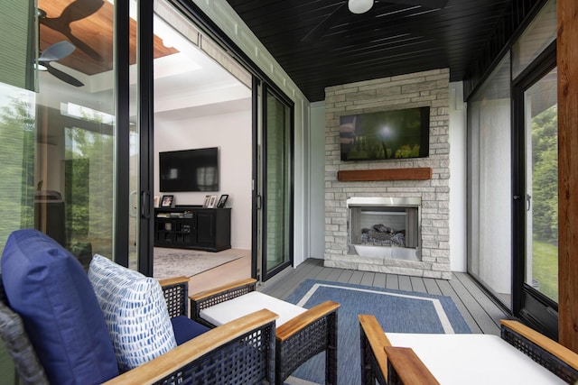 3733 E Hutcheson Ave, Springfield, MO 65802 - view of patio / terrace featuring ceiling fan and an outdoor stone fireplace