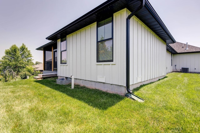 3733 E Hutcheson Ave, Springfield, MO 65802 - view of home's exterior with board and batten siding and a lawn