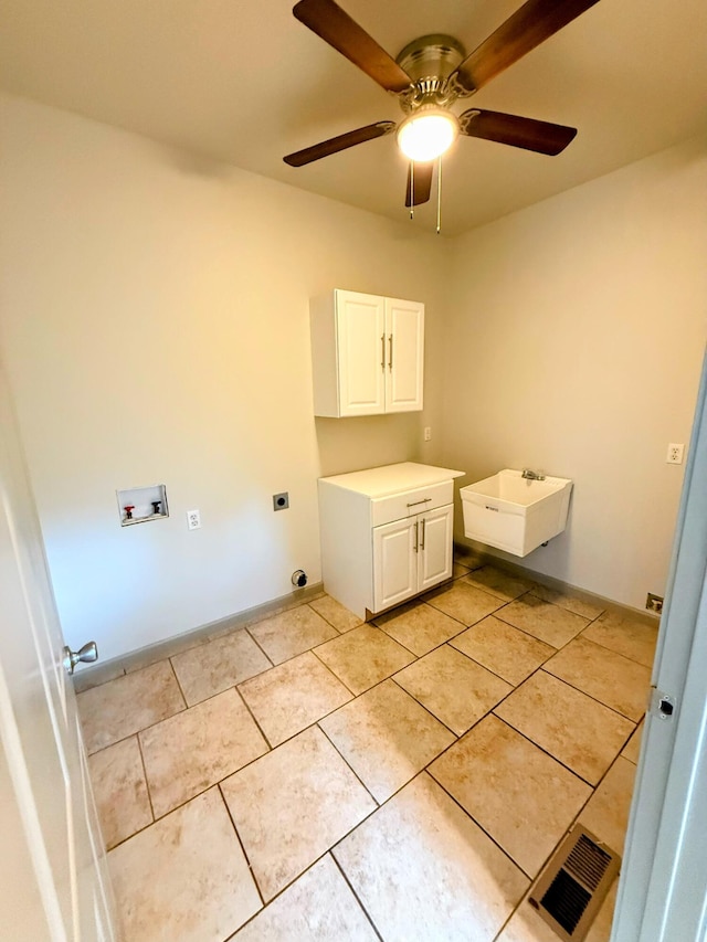 48 Galatians Ln, Reeds Spring, MO 65737 - washroom featuring hookup for a washing machine, hookup for an electric dryer, cabinet space, ceiling fan, and light tile patterned floors