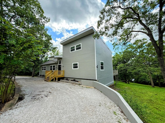 48 Galatians Ln, Reeds Spring, MO 65737 - rear view of property with driveway and a yard