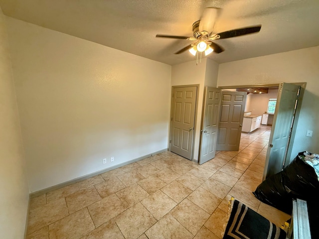 48 Galatians Ln, Reeds Spring, MO 65737 - unfurnished bedroom with a ceiling fan and a textured ceiling