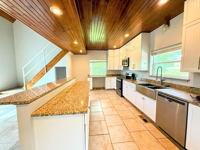 48 Galatians Ln, Reeds Spring, MO 65737 - kitchen with stainless steel appliances, wood ceiling, recessed lighting, a center island, and light tile patterned floors
