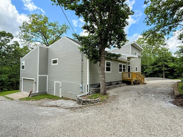 48 Galatians Ln, Reeds Spring, MO 65737 - view of side of home with driveway and a garage