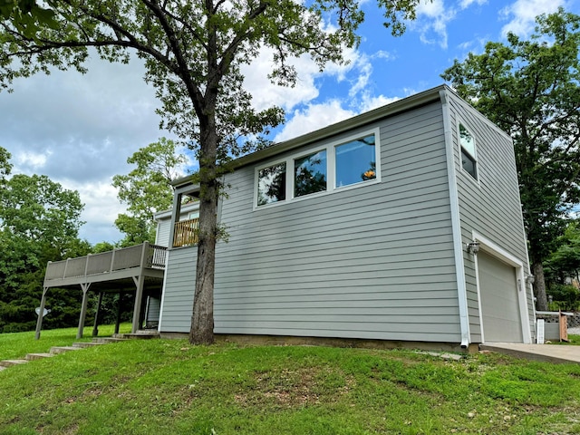 48 Galatians Ln, Reeds Spring, MO 65737 - view of side of property with a wooden deck, an attached garage, a yard, and driveway