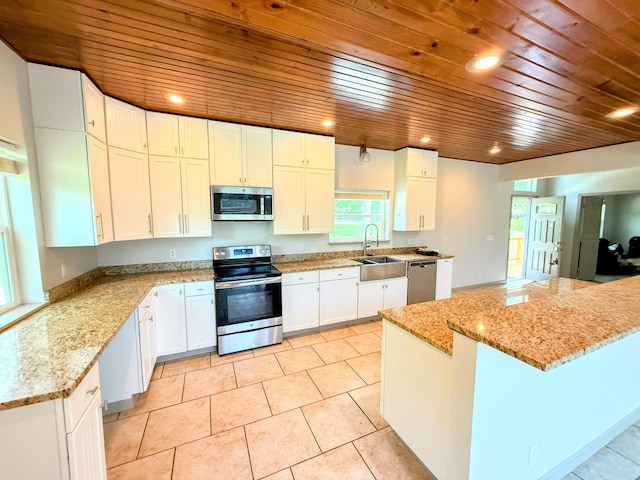 48 Galatians Ln, Reeds Spring, MO 65737 - kitchen featuring stainless steel appliances, wood ceiling, white cabinetry, light stone countertops, and recessed lighting