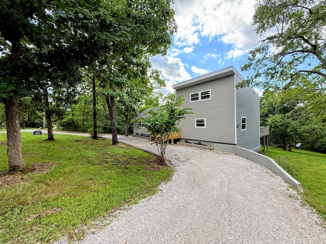 48 Galatians Ln, Reeds Spring, MO 65737 - view of side of property with driveway and a yard