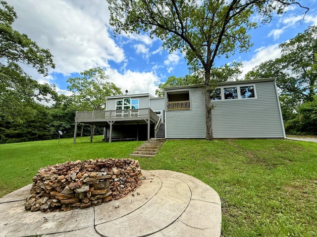 48 Galatians Ln, Reeds Spring, MO 65737 - back of house featuring stairway, a wooden deck, and a yard