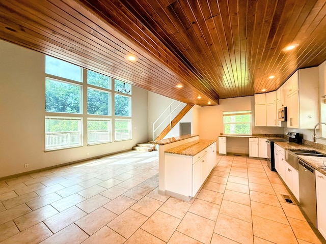 48 Galatians Ln, Reeds Spring, MO 65737 - kitchen featuring stainless steel appliances, wood ceiling, light tile patterned flooring, recessed lighting, and white cabinetry