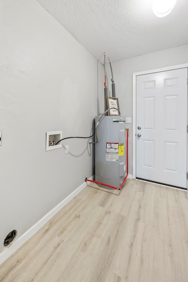 3936 S 77th Rd, Dunnegan, MO 65640 - utility room featuring water heater