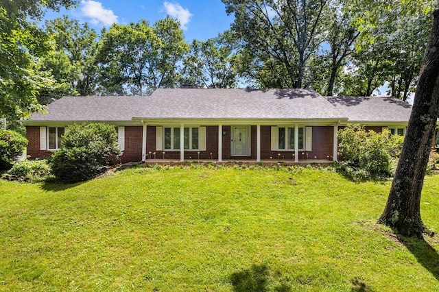 2538 E Wildwood Rd, Springfield, MO 65804 - ranch-style house featuring a front lawn, brick siding, and a chimney