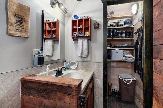 31 Mulberry Ln, Buffalo, MO 65622 - bathroom featuring tile walls, vanity, and wainscoting