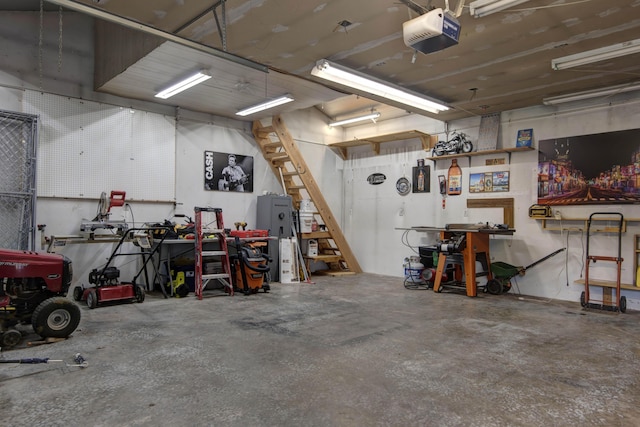 2718 E Blaine St, Springfield, MO 65803 - garage featuring a garage door opener and a workshop area