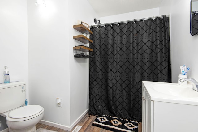 2718 E Blaine St, Springfield, MO 65803 - full bathroom featuring wood finished floors, vanity, and a shower with curtain