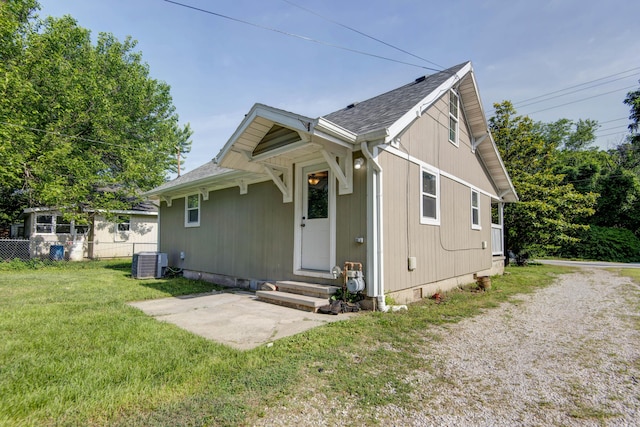 2718 E Blaine St, Springfield, MO 65803 - view of front of home featuring entry steps, crawl space, roof with shingles, and a patio area