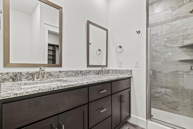 1305 W Ragweed Ct, Ozark, MO 65721 - full bathroom featuring double vanity and a shower stall