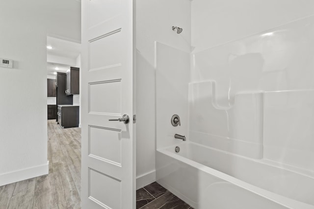 1305 W Ragweed Ct, Ozark, MO 65721 - bathroom featuring shower / washtub combination and baseboards