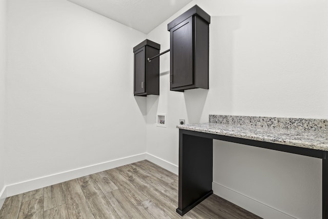 1305 W Ragweed Ct, Ozark, MO 65721 - laundry area with cabinet space, hookup for a washing machine, light wood finished floors, and electric dryer hookup