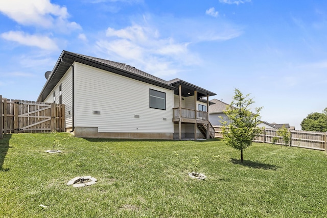 1305 W Ragweed Ct, Ozark, MO 65721 - back of house featuring a fenced backyard, stairway, and a gate