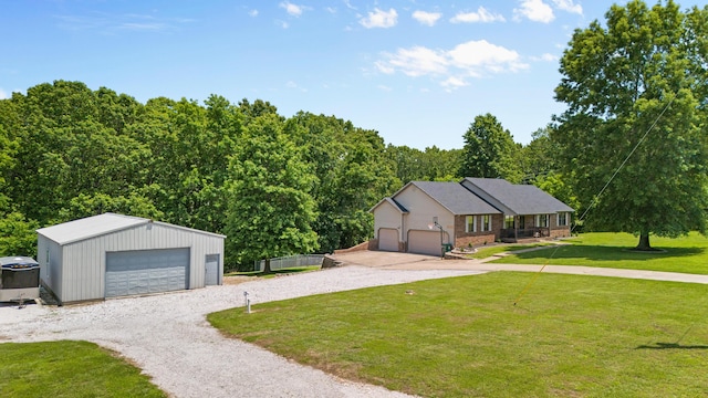241 Sage Rd, Ozark, MO 65721 - view of front of property featuring a front lawn, a detached garage, and an outbuilding