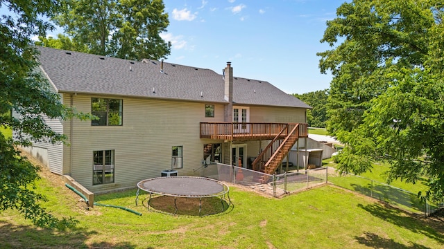 241 Sage Rd, Ozark, MO 65721 - back of house with a trampoline, a deck, french doors, a chimney, and stairway