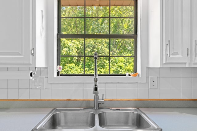 241 Sage Rd, Ozark, MO 65721 - kitchen with white cabinets, light countertops, and decorative backsplash
