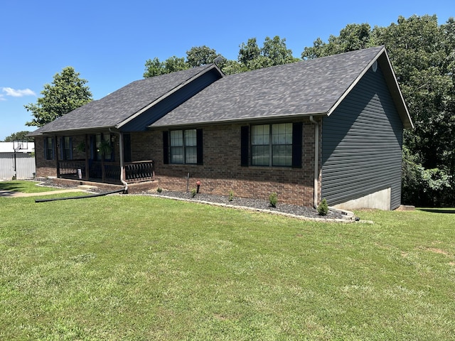 241 Sage Rd, Ozark, MO 65721 - view of front of home featuring a front lawn, a shingled roof, and brick siding