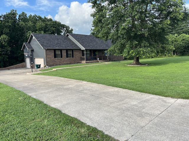 241 Sage Rd, Ozark, MO 65721 - ranch-style house featuring brick siding, concrete driveway, a front yard, a garage, and roof with shingles