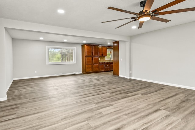 7047 W Lone Oak St, Springfield, MO 65803 - unfurnished living room featuring recessed lighting, wood finished floors, and a ceiling fan
