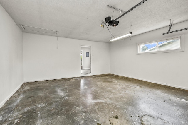 7047 W Lone Oak St, Springfield, MO 65803 - garage with a garage door opener and baseboards