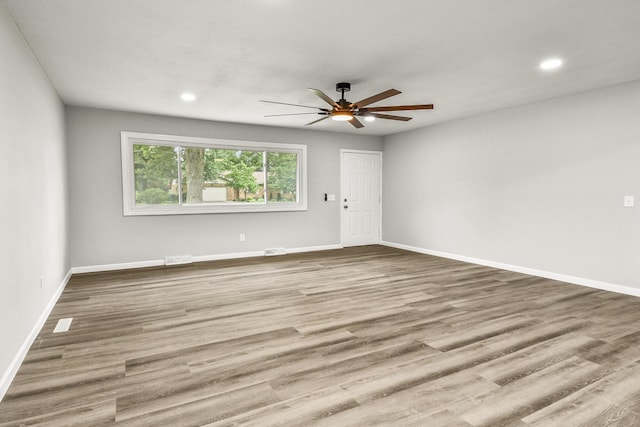7047 W Lone Oak St, Springfield, MO 65803 - unfurnished room featuring ceiling fan, wood finished floors, and recessed lighting