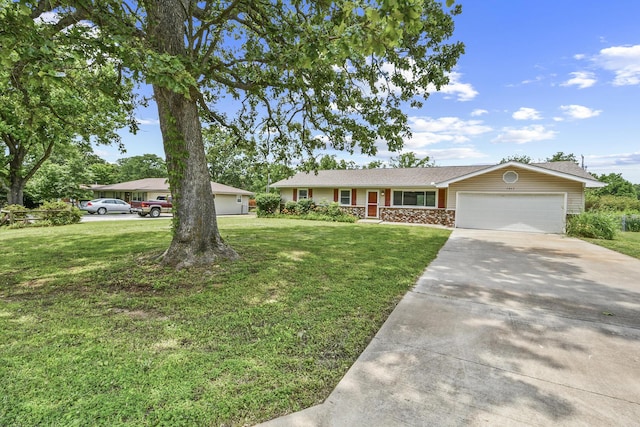7047 W Lone Oak St, Springfield, MO 65803 - ranch-style house with an attached garage, concrete driveway, and a front lawn